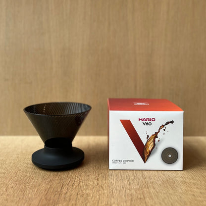HARIO V60 NEO coffee dripper with innovative design on wooden background.