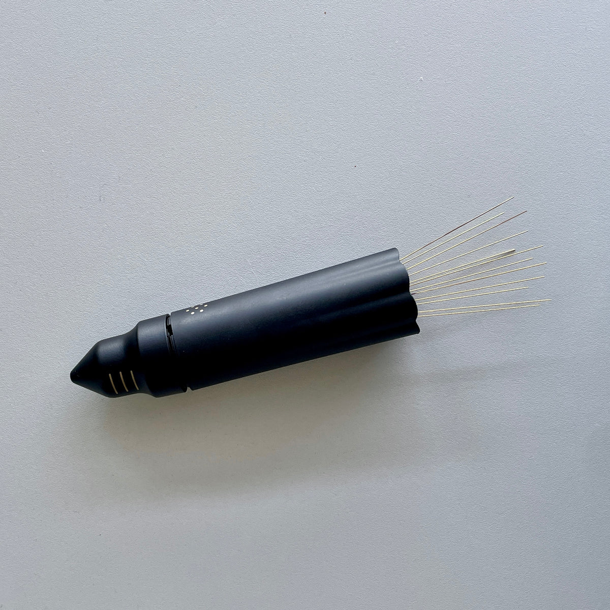 NUCLEUS BLOOM coffee tool with dual-needle system for even extraction and reduced static.