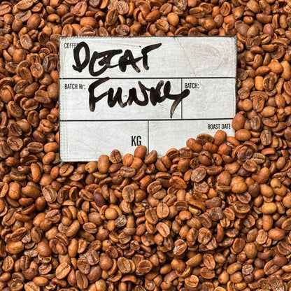 DECAF FUNKY coffee beans with batch label, showcasing vibrant Colombian flavor and specialty decaffeinated coffee.