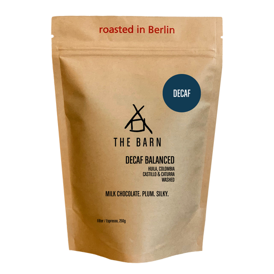 DECAF BALANCED coffee bag featuring a clean Colombian cup profile with notes of milk chocolate and plum.